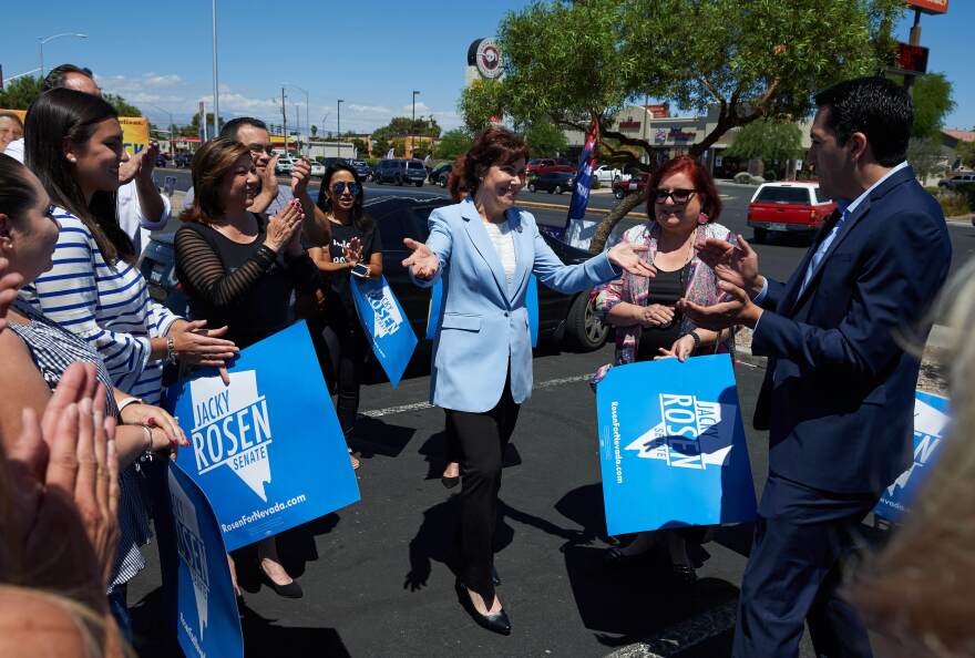 Rep. Jacky Rosen (center), the Democratic U.S. Senate candidate in Nevada, greets supporters ahead of early voting at Cardenas Supermarket in Las Vegas on May 26.