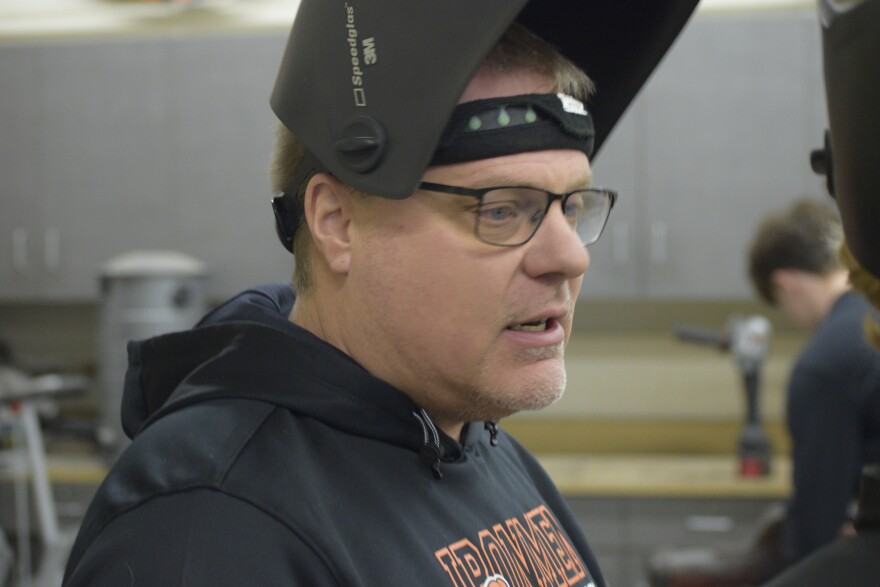 Don Whitman gives instruction to a student during class Friday.