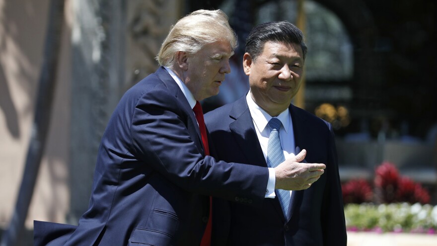 President Trump and his Chinese counterpart, President Xi Jinping, walk together at the Mar-a-Lago resort in Palm Beach, Fla., on April 7.