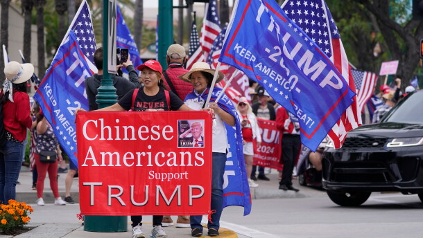 FILE - Chinese Americans supporters of former President Donald Trump stand outside the hotel where the 2023 Fall California Republican Convention is being held in Anaheim, Calif., Sept. 29, 2023. (AP Photo/Damian Dovarganes, File)