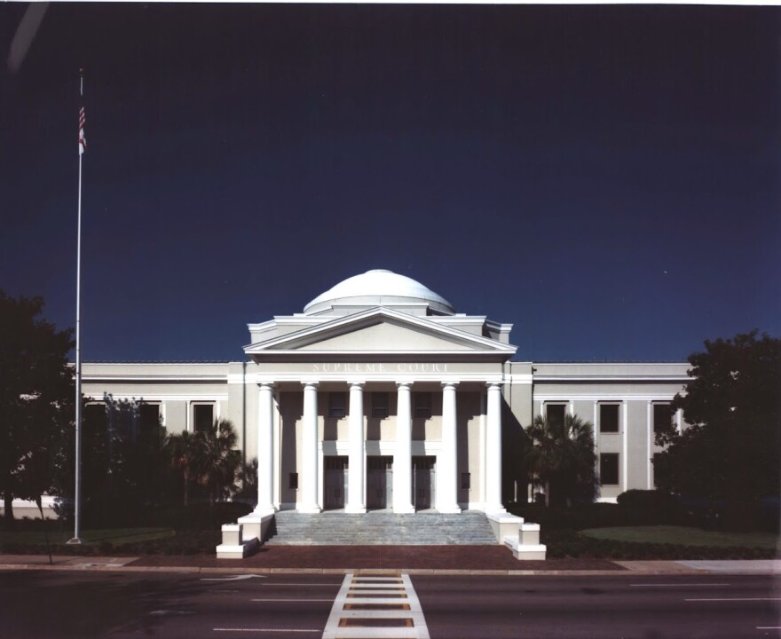 Florida Supreme Court building. White stone structure with pillars and a dome.