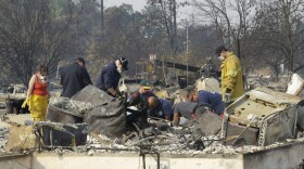 Authorities sift through the burned area of a home as they search for victims at Coffey Park area of Santa Rosa, Calif., Monday, Oct. 16, 2017. (Rich Pedroncelli/AP)