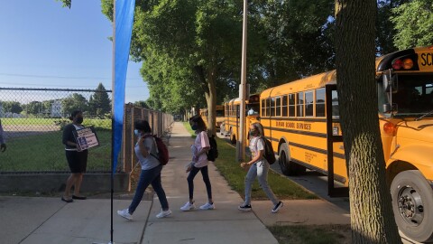 Student disembark from a Milwaukee Public Schools bus.