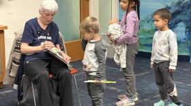 Jerri Thomas reads to children during the Hear me Roar story hour.