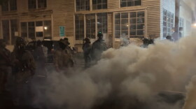 Federal officers spray and throw chemical gases at demonstrators a block up from the ICE processing facility south of downtown Portland on Saturday, Oct. 5, 2025.