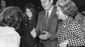 In this file photo, date and location not known, former Washington Gov. Al Rosellini, second from right, votes as his wife, Ethel, right, and his daughter, Lynn, third from right, look on.