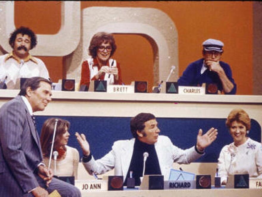 The participants on an early episode ofÂ <em>Match Game</em>, including Richard Dawson in the lower center position.