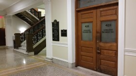 A 2014 photograph of the fourth floor of the Massachusetts Statehouse just outside the public galleries and the press room.