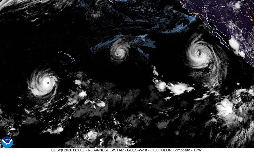 A satellite image shows from left to right, Hurricane Lowell, Hurricane Karina and Hurricane Marie in the Pacific on Friday night.
