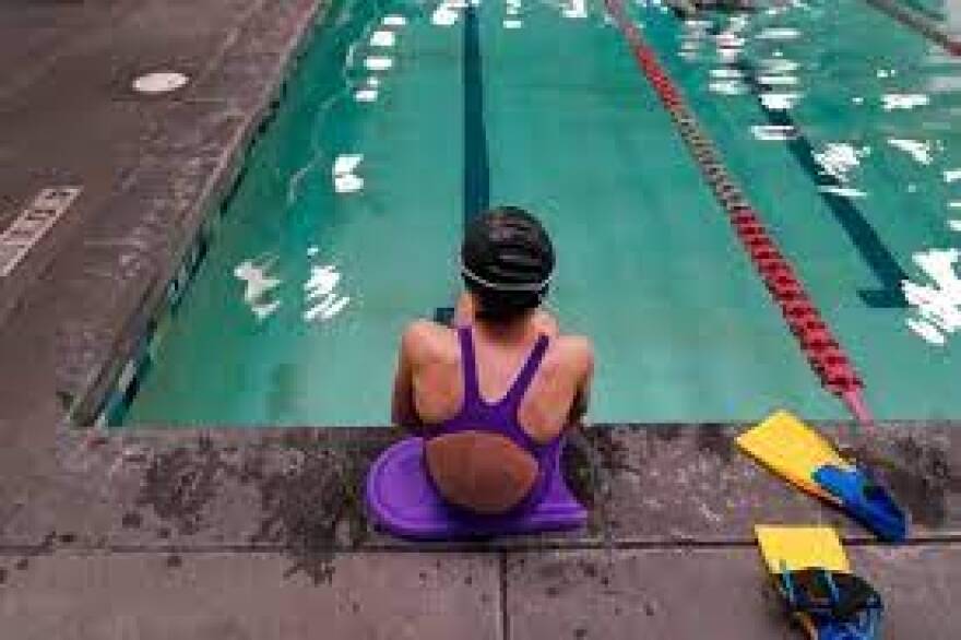 A 12 year old transgender swimmer is seen waiting by a pool on February 22, 2021 in Utah. She and her family spoke to the associated press on the condition of anonymity. Two transgender athletes and their families filed a lawsuit Tuesday, June 1, 2022, to challenge the states new ban on transgender players competing in girls sports.