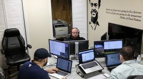 Software coders (from left) William Stevens, Michael Harrison and Brack Quillen work at the Bit Source office in Pikeville, Ky., in February. The year-old firm has trained laid-off coal workers to become software coders.