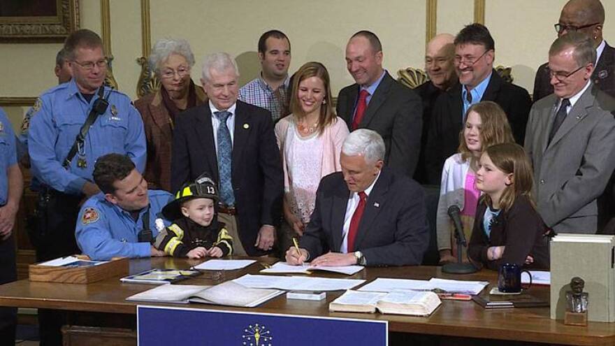 Gov. Mike Pence signs the "Right to Try" legislation into law.