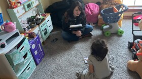 Child-welfare worker Kaitlin Davis reads to foster children who are among her cases.