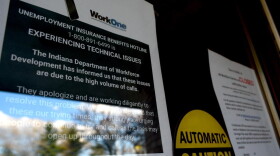 A sign informs visitors that while WorkOne employment offices are closed, the Department of Workforce Development is experiencing technical issues due to high call volumes.