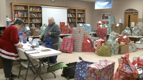 Volunteers prepare gifts for donation at Trinity Lutheran Church