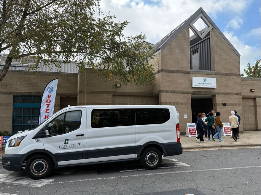 van in front of polling place