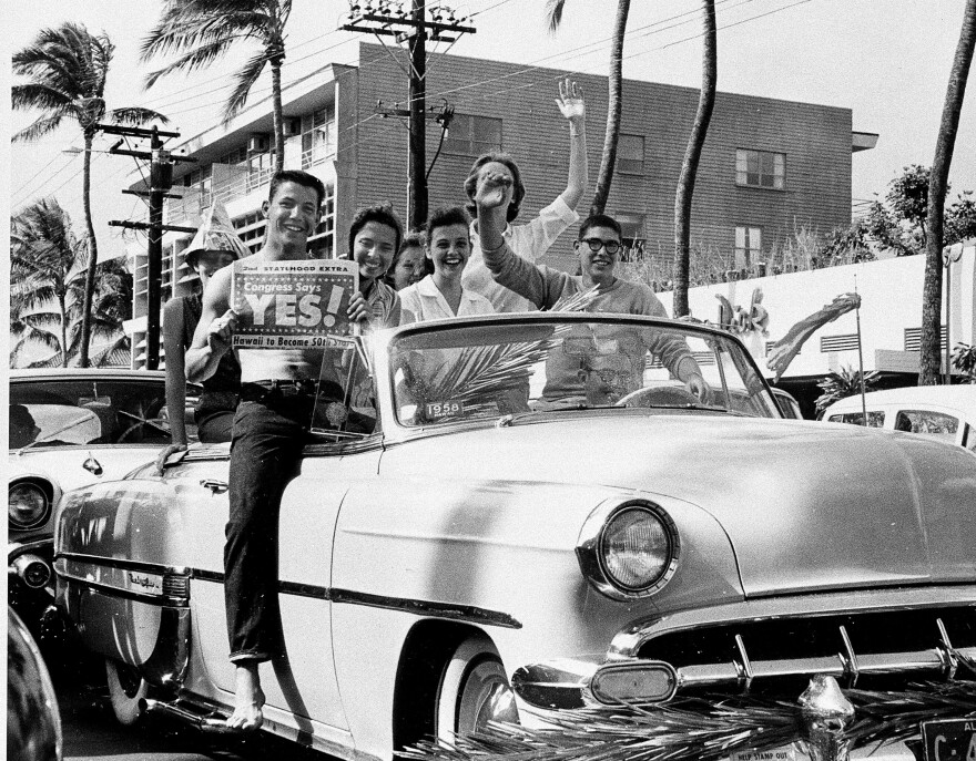 A group of supporters of statehood drive through the street in Waikiki, Honolulu, Hawaii, on March 13, 1959.