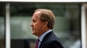 Attorney General Ken Paxton speaks at a news conference at the Houston Recovery Center on October 26, 2021. Paxton was temporarily suspended from office after the House voted last month to impeach him. 