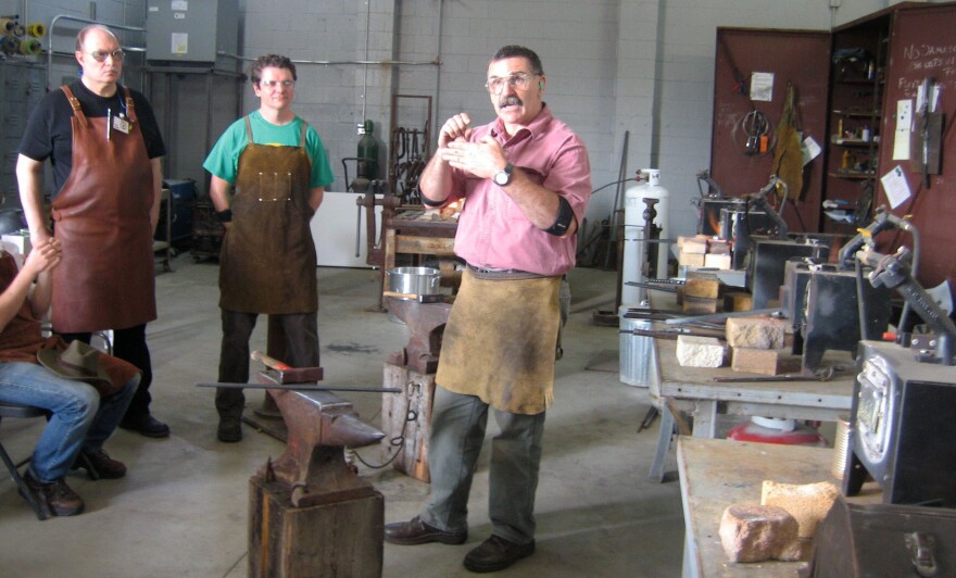 Mark Aspery (right) teaches a blacksmith class at Adam's Forge in Los Angeles.