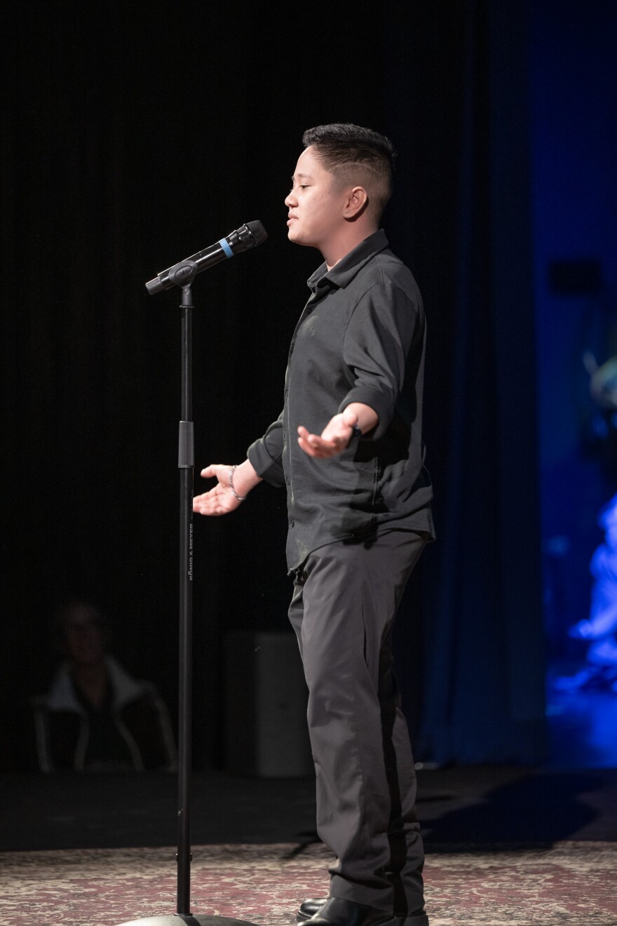 Storyteller Karl speaks onstage at the Immigrant Voices event at The Arts Campus at Willits. March 12, 2026.