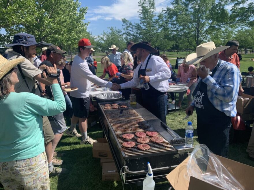 Ammon and Cliven Bundy served burgers at Julius M. Kleiner Memorial Park in Meridian on June 19 during Bundy’s campaign kickoff event. (Clark Corbin/Idaho Capital Sun)