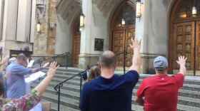 About a dozen people held a vigil on the front steps of the cathedral. Organizers say they're encouraged by the Diocese of Cleveland releasing the names of priests who were removed from their posts due to sex abuse allegations.