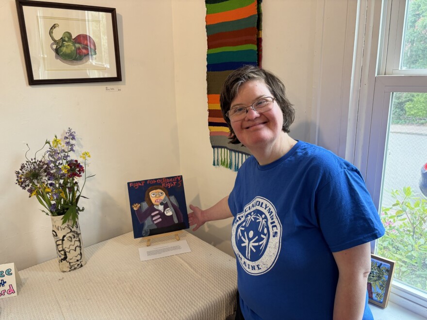 Anna McDougal with her portrait of Judith Heumann.