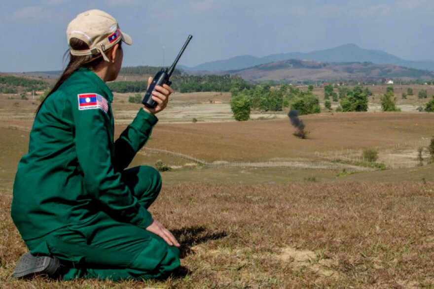 MAG's Provincial Operations Manager overseas a controlled demolition of cluster munitions or "bombies" found during MAG's UXO clearance operations in XK Province.