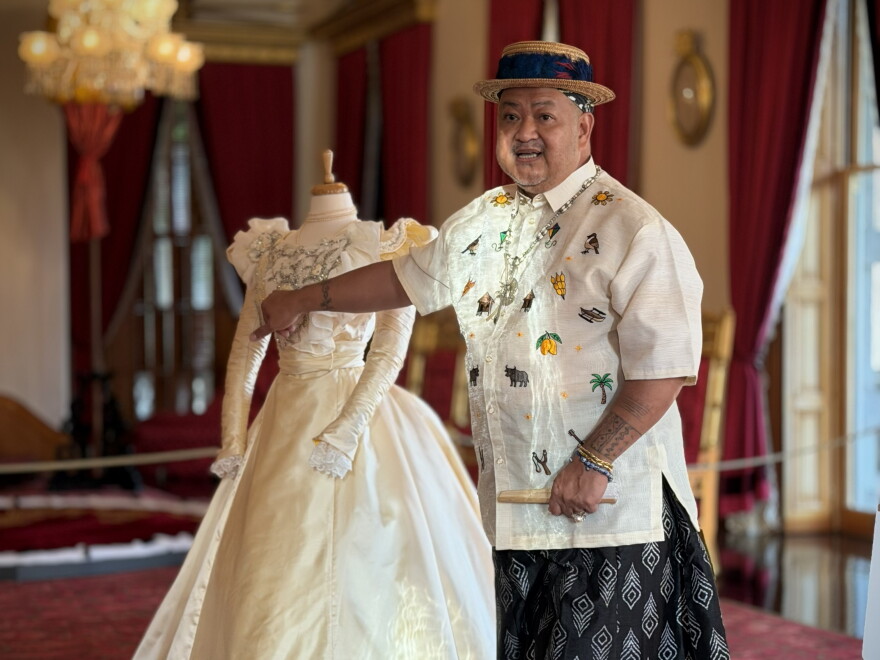 Historic costume designer Iris Gil Viacrusis presents his recreation of Princess Kaʻiulani's ivory ball gown at ʻIolani Place. (Oct. 16, 2026)