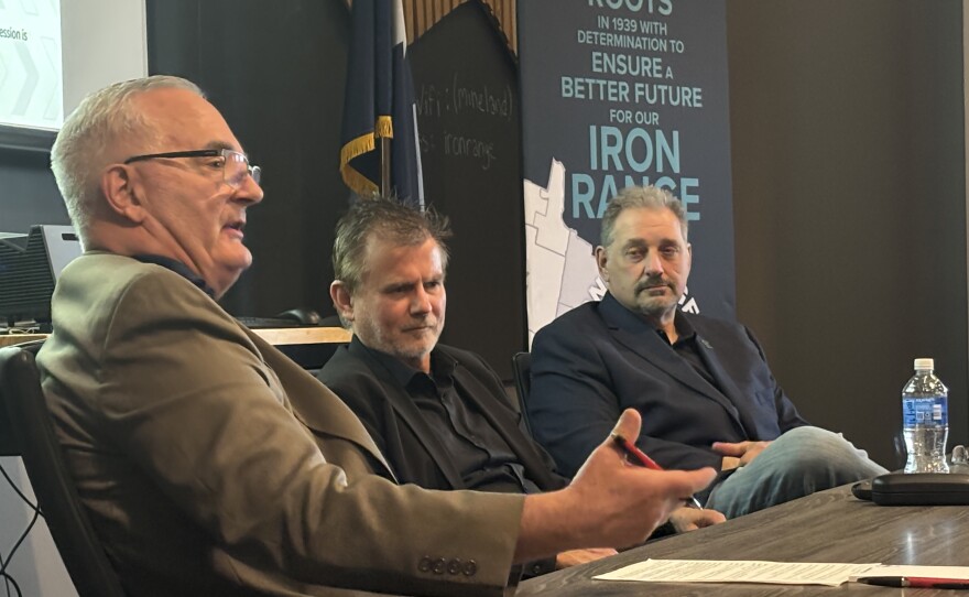 Hibbing Mayor Pete Hyduke, left, Rock Ridge Superintendent Noel Schmidt, center, and St. Louis County Commissioner Mike Jugovich, right, spoke on a panel April 22, 2026, at a meeting in Chisholm about the budget impacts of a downturn in mine production.