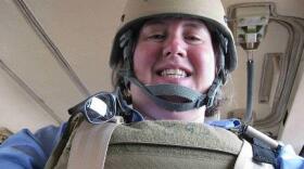 Dr. Sue Sroda in a military transport in Iraq.
