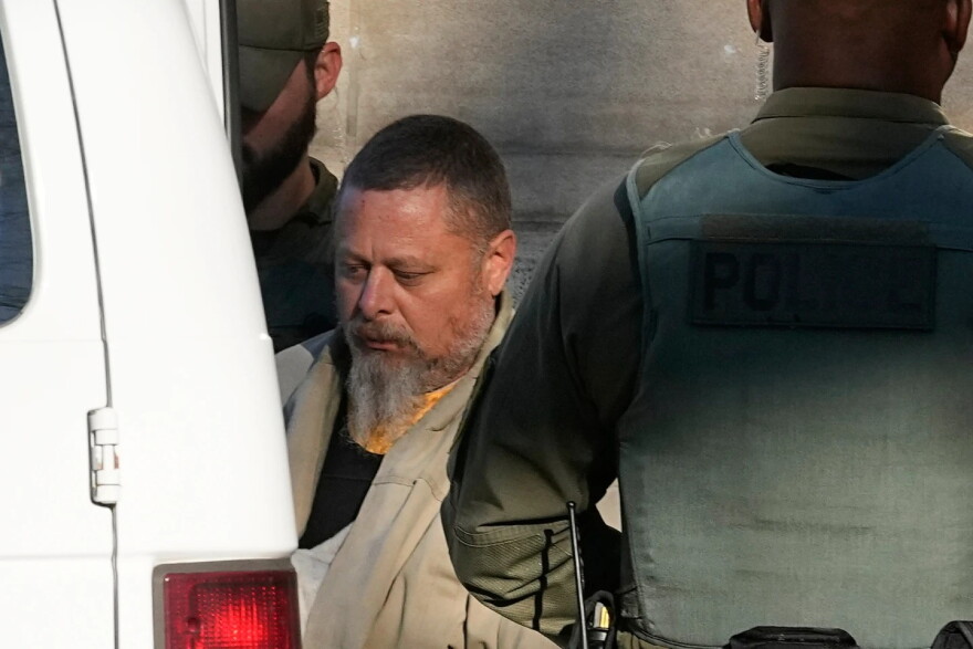 Officers escort Richard Allen out of the Carroll County courthouse following a hearing, Nov. 22, 2022, in Delphi, Ind.