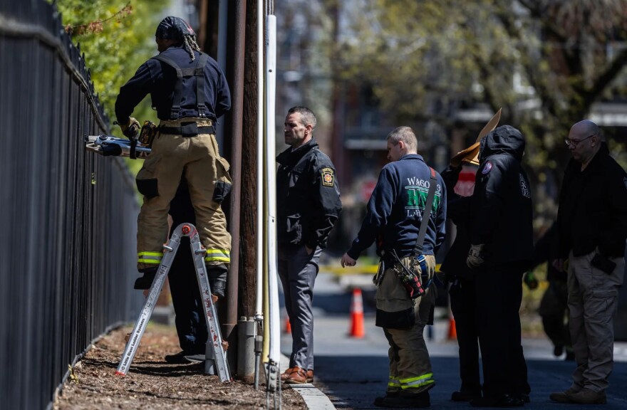 Police are seen outside the Pennsylvania governor's residence Sunday morning, April 13, 2025, during investigation into the previous night's fire.
