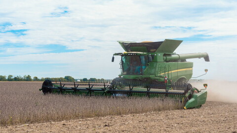 A farmer harvests soybeans on a field that uses no-till planting and cover crops in Brownsburg, Indiana. A new report shows financial support for on-farm conservation practices is most effective when tied to the impact on water quality.