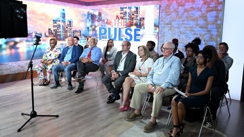 Apple attend a debate between U.S. Senate candidates Abdul El-Sayed and U.S. Rep. Haley Stevens, Monday, July 27, 2026, in Southfield, Mich. (Robin Buckson/Detroit News via AP, Pool)