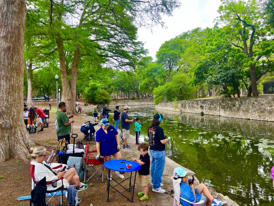 Anglers try their luck in the San Antonio River during Family Fishing Day on Saturday, April 11, 2026