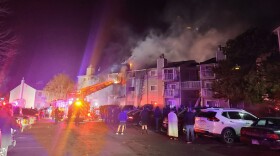 This photo released by the Aurora Fire Rescue shows the scene where a fire swept through a three-story apartment building in Aurora, Colorado on Monday, Jan. 24, 2022. Officials say that a child died after firefighters rescued people unable to escape on their own before dawn.