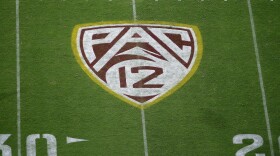 FILE - The field at Sun Devil Stadium bears a Pac-12 logo during an NCAA college football game between Arizona State and Kent State in Tempe, Ariz., Aug. 29, 2019. (AP Photo/Ralph Freso, File)
