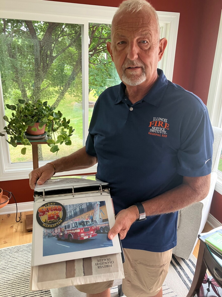 Ray Palczynski (who's worked in fire service 45 years) with his scrapbook of 9/11 memories, at his Bettendorf home Sept. 9, 2026.