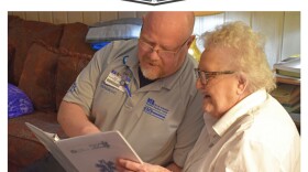 Jason Moshier, North Arkansas Regional Medical Center Community Paramedics section chief, visits with Julie Younes, an 87-year old  Community Paramedic program patient.