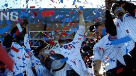 Chicago Cubs' Jon Lester holds the Commissioners Trophy as he celebrates with teammates at Grant Park in Chicago, Friday, Nov. 4, 2016. The trophy is now on a tour across the Midwest.