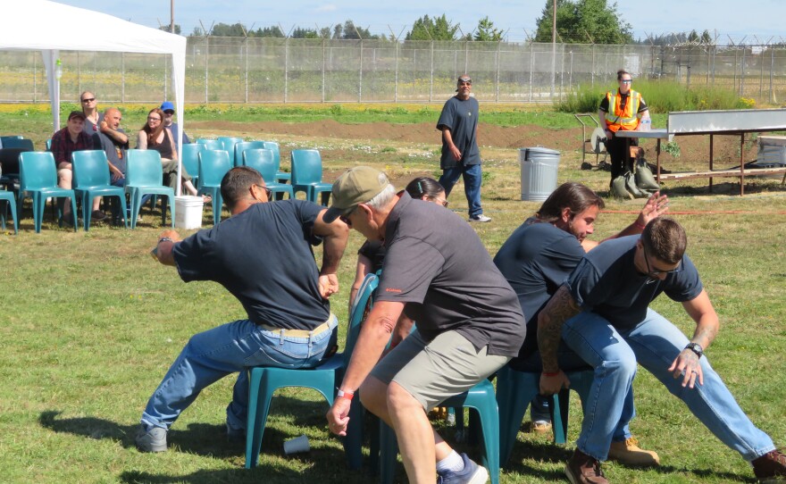 People lunging for chairs.