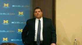 Brady Hoke awaits the media at his first press conference as Michigan's head coach earlier this year.