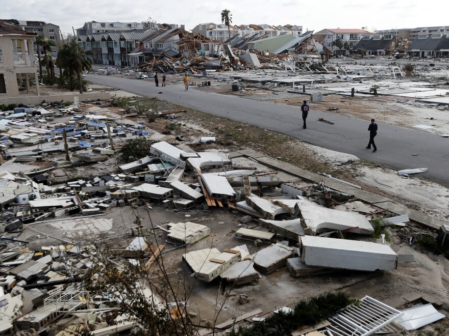 Rescue personnel walk through debris in Mexico Beach, Fla., which was devastated by Hurricane Michael.