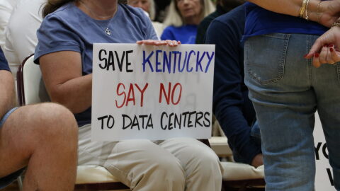Many of the attendees at the Mercer County Fiscal Court meeting brought signs expressing opposition to data centers.