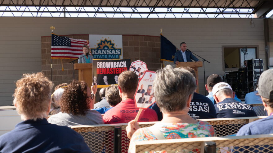 Democrat Cindy Holscher and Republican Ty Masterson appear at the Sept. 12, 2026, debate at the Kansas State Fair. The two rivals for governor agree on the need to reduce property taxes for homeowners but clash on the details.