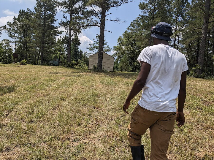 Markel Thompson walks up the hill towards the site of his future home on June 20, 2023, in McCool, Mississippi.