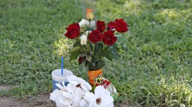 The grave site of Manuel "Manny" Castro Garcia, 19, at a cemetery Thursday, July 14, 2016, in Phoenix. The teen was killed in June, and is one of a growing number of victims associated with a serial killer according to police. (Ross D. Franklin/AP)