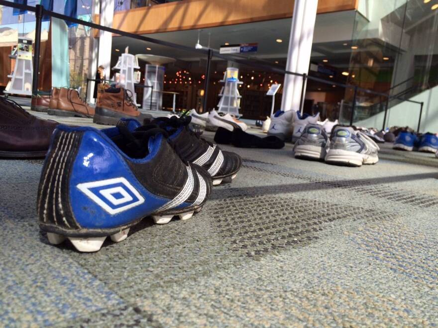 135 pairs of shoes at the Central Library represent Indy's 135 victims of criminal homicide in 2014.