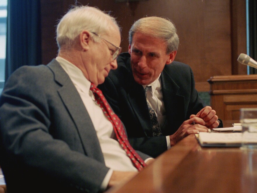 Sen. Dan Coats, right, talks with Sen. John S. McCain prior to testifying before a Senate Budget Committee hearing in 1995.